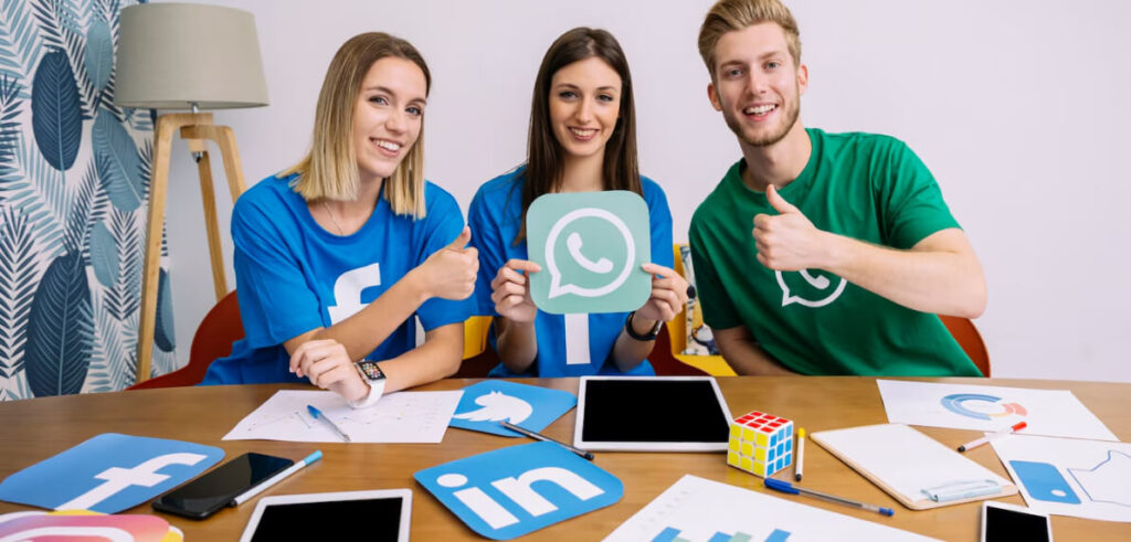 team with social media icons in hand